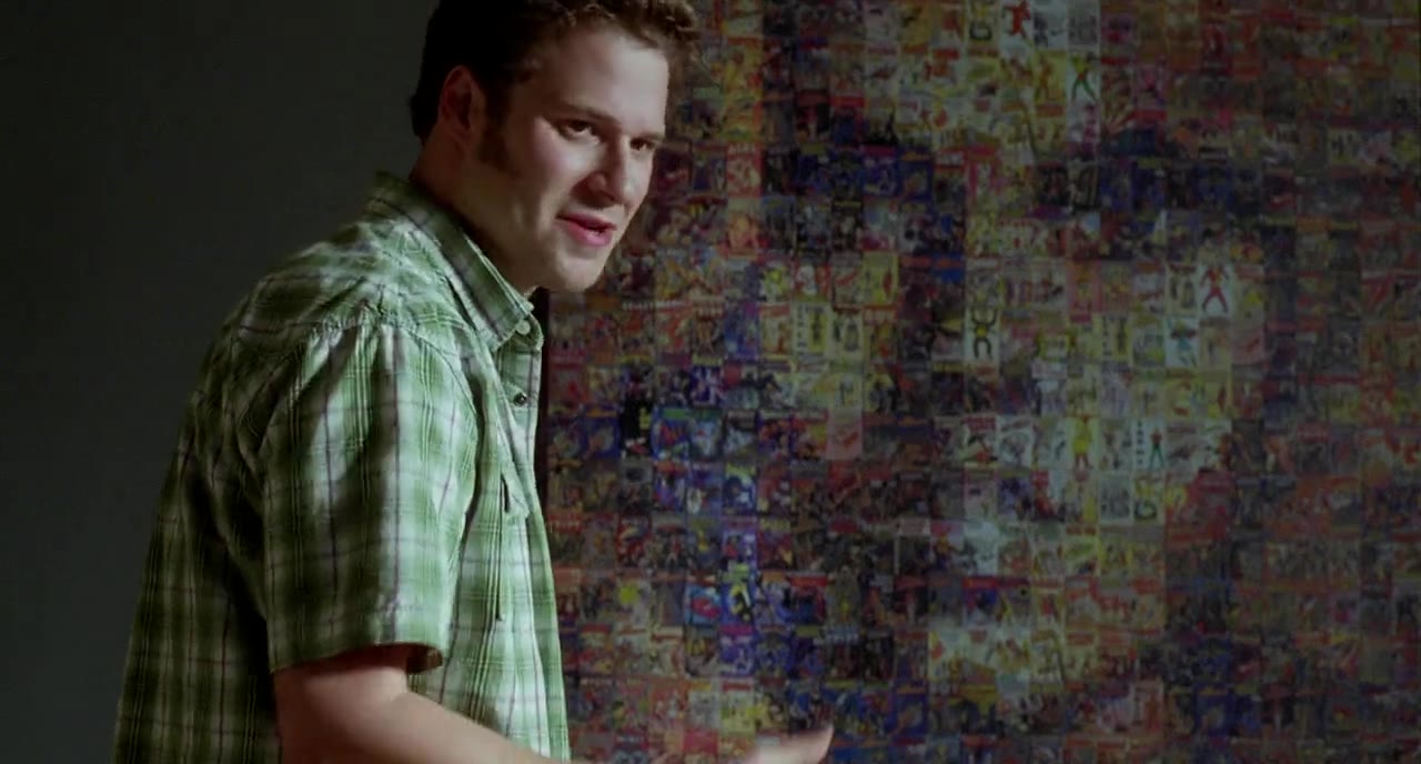 Seth Rogen in front of Barbarella mosaic poster.
Still frame from &lquot;Funny People&rquot; movie.